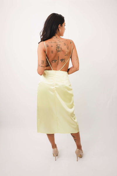 Back view of Daisy Yellow Lace Dress featuring open back design with thin straps.