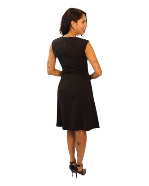 Ena Black Midi Dress with swing skirt worn by model.