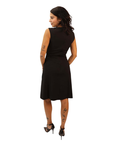 Ena Black Midi Dress with swing skirt and sleeveless design.