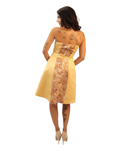 Victoria Gold Midi Print Dress with A-line silhouette and floral design.